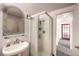 Bathroom with sink, shower, and access to hallway at 3968 Mont Blanc Way, Las Vegas, NV 89124