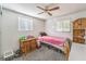 Bedroom with twin bed, dresser, and ceiling fan at 3968 Mont Blanc Way, Las Vegas, NV 89124