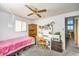 Bedroom with twin bed, desk, and built-in shelving at 3968 Mont Blanc Way, Las Vegas, NV 89124