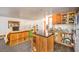 Open concept kitchen with island, wood cabinets, and living room view at 3968 Mont Blanc Way, Las Vegas, NV 89124