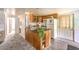 Cozy kitchen features wood cabinets, granite island, and appliances at 3968 Mont Blanc Way, Las Vegas, NV 89124