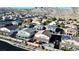 Aerial view of a neighborhood with houses with pools, and mountain backdrop, offering scenic views at 4050 Peaceful Dune St, Las Vegas, NV 89129