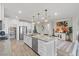 Modern kitchen featuring a large island, stainless steel appliances, and granite countertops at 4050 Peaceful Dune St, Las Vegas, NV 89129