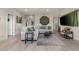 Cozy living area featuring a gray sectional sofa, decorative accents, and bright, natural light at 4050 Peaceful Dune St, Las Vegas, NV 89129