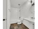 Bathroom showcases a pedestal sink, decorative lighting, tub with tile surround at 3427 Manzano Cir, Las Vegas, NV 89121