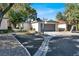Well-maintained condo with a two-car garage, additional parking, and mature landscaping at 3427 Manzano Cir, Las Vegas, NV 89121