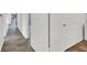 Hallway with tile flooring leading to several rooms in the house at 3427 Manzano Cir, Las Vegas, NV 89121