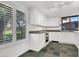 Bright kitchen with white cabinetry, appliances, granite counters, and view of the yard at 3427 Manzano Cir, Las Vegas, NV 89121