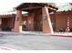 Exterior view of the clubhouse with desert landscaping and ample parking at 498 Canyon View Way, Mesquite, NV 89027