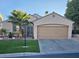 Attractive single-story home boasting a meticulously landscaped front yard with green artifical turf at 11261 Playa Caribe Ave, Las Vegas, NV 89138