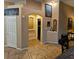 Hallway with arched doorway features tile flooring and neutral paint, enhancing the home's character at 11261 Playa Caribe Ave, Las Vegas, NV 89138