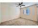 Carpeted bedroom with ceiling fan and window with blinds at 2731 Heathrow St, Las Vegas, NV 89135