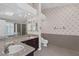 Double vanity bathroom with granite countertops and patterned tile at 3767 Darren Thornton Way, Las Vegas, NV 89120