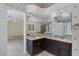 Double vanity bathroom with granite countertops and large mirror at 3767 Darren Thornton Way, Las Vegas, NV 89120