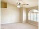 Large bedroom with vaulted ceiling, ceiling fan, and window with shutters at 3767 Darren Thornton Way, Las Vegas, NV 89120