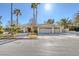 House exterior showcasing a three-car garage and palm trees at 3767 Darren Thornton Way, Las Vegas, NV 89120