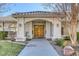 Double wood doors and walkway leading to house entrance at 3767 Darren Thornton Way, Las Vegas, NV 89120