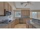 Modern kitchen with stainless steel appliances and granite countertops at 3767 Darren Thornton Way, Las Vegas, NV 89120