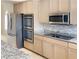 Bright kitchen boasts stainless steel appliances and granite countertops at 3767 Darren Thornton Way, Las Vegas, NV 89120