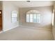 Spacious living room with large windows and neutral color palette at 3767 Darren Thornton Way, Las Vegas, NV 89120