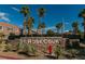 Community entrance with St. Rose Court signage and landscaping at 10111 Aspen Rose St # 101, Las Vegas, NV 89183