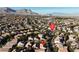 A wide aerial shot of homes in a neighborhood nestled against a backdrop of mountains, offering a sense of community and scenic beauty at 11605 Cabo Del Sol Ct, Las Vegas, NV 89138