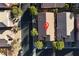 An aerial view captures a residential area with houses featuring similar roofs, interspersed with greenery and a visible street layout at 11605 Cabo Del Sol Ct, Las Vegas, NV 89138