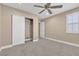 Bedroom featuring neutral tones, carpet flooring, ceiling fan, and closet at 11605 Cabo Del Sol Ct, Las Vegas, NV 89138