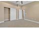 Bedroom with plush carpet, neutral walls, closet and an adjoining bathroom at 11605 Cabo Del Sol Ct, Las Vegas, NV 89138