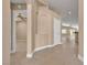 Home entryway showcasing neutral paint, tan tile flooring, and archway leading to other rooms at 11605 Cabo Del Sol Ct, Las Vegas, NV 89138