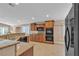 Spacious kitchen featuring granite countertops, tile flooring and stainless steel appliances at 11605 Cabo Del Sol Ct, Las Vegas, NV 89138