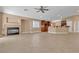 Bright living room featuring a fireplace, tile flooring, and an open layout into the kitchen at 11605 Cabo Del Sol Ct, Las Vegas, NV 89138