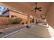 Spacious covered patio featuring ceiling fans and concrete flooring, perfect for outdoor entertaining at 11605 Cabo Del Sol Ct, Las Vegas, NV 89138