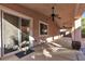 Covered patio features stamped concrete and a ceiling fan at 11605 Cabo Del Sol Ct, Las Vegas, NV 89138