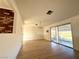 Bright dining room with hardwood floors and sliding glass doors at 1720 W Bell Vista Ave, Pahrump, NV 89060