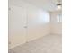 Simple bedroom with tile floors and a closet at 4386 El Carnal Way, Las Vegas, NV 89121