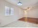 Tile floor dining area with updated lighting and access to kitchen at 4386 El Carnal Way, Las Vegas, NV 89121