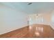 Hardwood floor living room with an open floor plan and neutral walls at 4386 El Carnal Way, Las Vegas, NV 89121