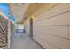 Covered walkway leading to a gate, offering privacy and shade at 4386 El Carnal Way, Las Vegas, NV 89121