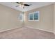 Well-lit bedroom with ceiling fan and plantation shutters at 866 La Sconsa Dr, Las Vegas, NV 89138