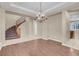 Dining room with hardwood floors, chandelier and staircase at 866 La Sconsa Dr, Las Vegas, NV 89138