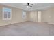 Large main bedroom with carpet flooring and access to bathroom at 866 La Sconsa Dr, Las Vegas, NV 89138