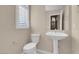 Small bathroom with pedestal sink and toilet at 866 La Sconsa Dr, Las Vegas, NV 89138