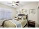 Guest bedroom with ceiling fan and window coverings at 8737 Red Brook Dr # 103, Las Vegas, NV 89128