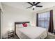 Spacious bedroom with ceiling fan and large window at 8737 Red Brook Dr # 103, Las Vegas, NV 89128