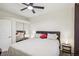 Well-lit bedroom with mirrored closet and ceiling fan at 8737 Red Brook Dr # 103, Las Vegas, NV 89128