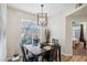 Bright dining room with a table, chairs, and a view into the bedroom at 8737 Red Brook Dr # 103, Las Vegas, NV 89128