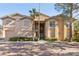 Two-story building exterior with attractive landscaping and brick pavement at 8737 Red Brook Dr # 103, Las Vegas, NV 89128