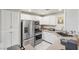 Modern kitchen with stainless steel appliances and white cabinets at 8737 Red Brook Dr # 103, Las Vegas, NV 89128