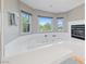 Relaxing bathroom with a jetted tub and fireplace at 8904 Saint Pierre Dr, Las Vegas, NV 89134